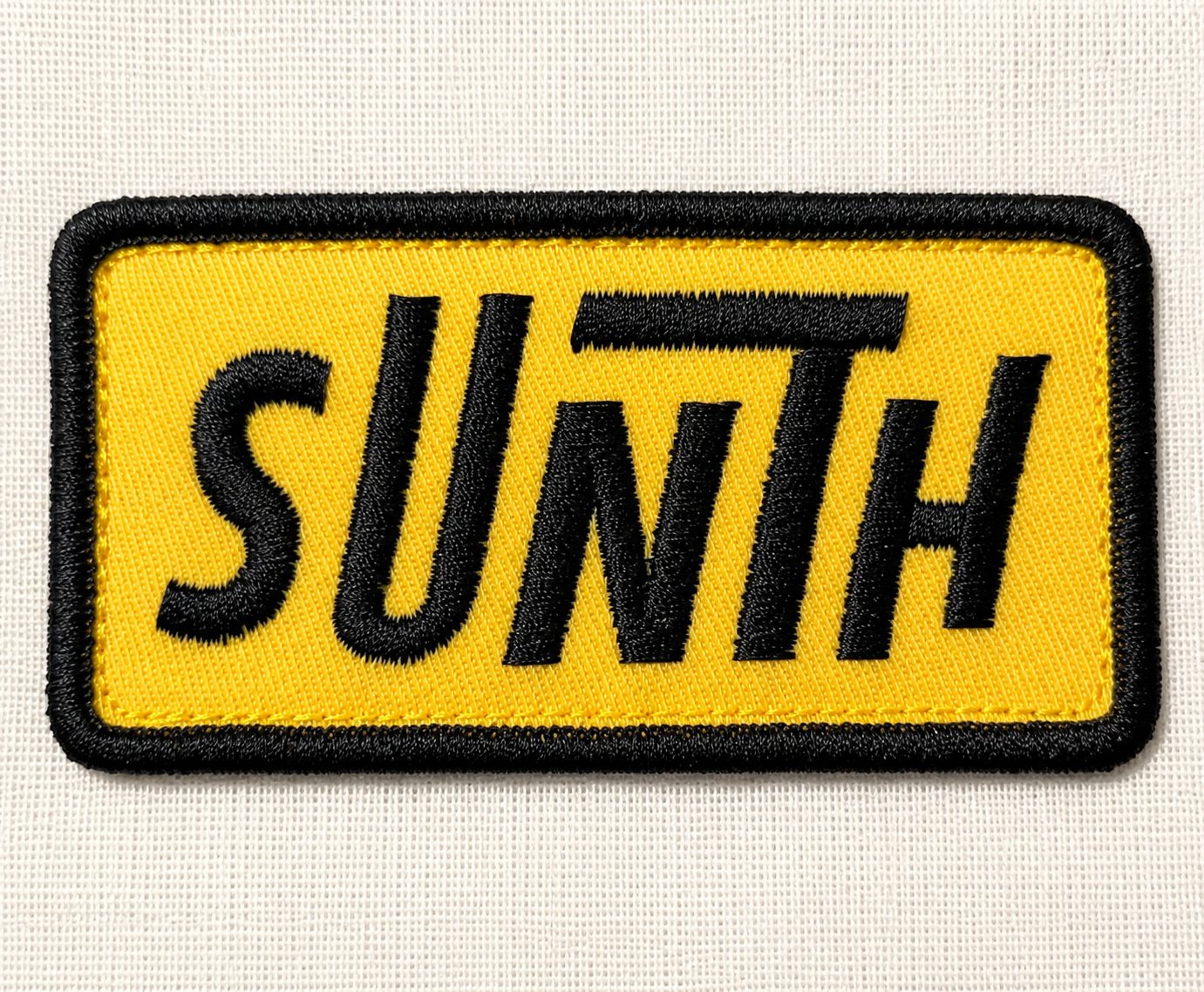 Close-up of an embroidered patch with raised stitching