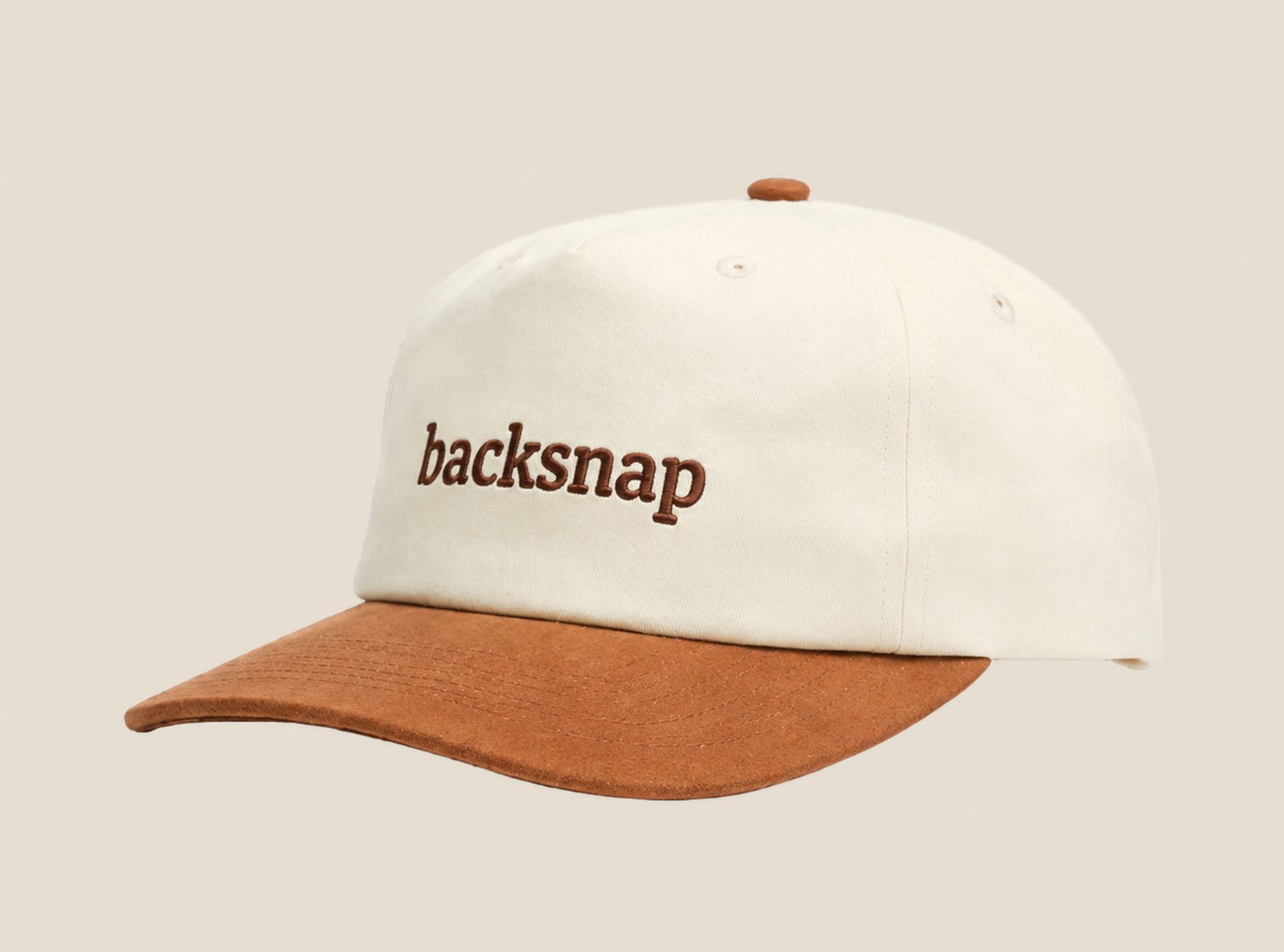Cream and brown Backsnap embroidered cap, angled view