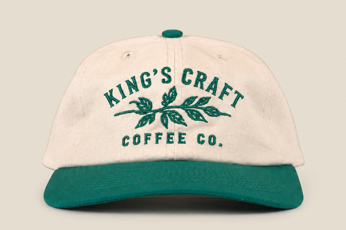 Cream and green King's Craft Coffee embroidered cap, front view