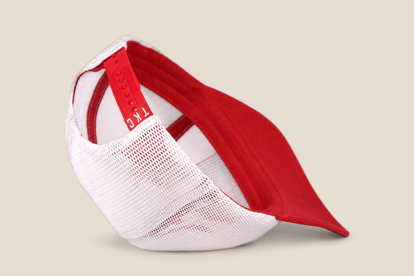 White mesh King's Craft Coffee trucker cap, back with red snapback strap
